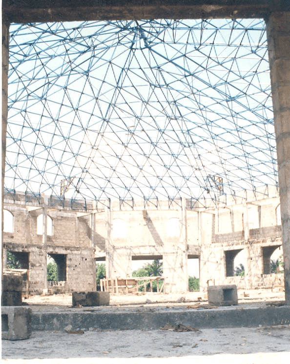 CHURCH HALL ROOF OCTAGONAL SHAPED WITH 35m MINIMUM FREE SPAN in all directions Designed and built with our proprietary space frame units for HOLY FAMILY CATHOLIC CHURCH, Edjeba, Warri, Delta State, Nigeria in 1998.
                            .